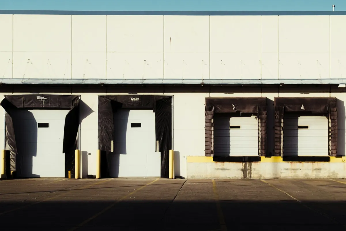 Row of loading dock doors with dock seals on a warehouse