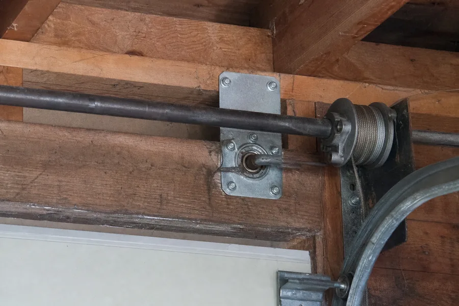 End bearing plate and cable drum above a garage door in York, PA